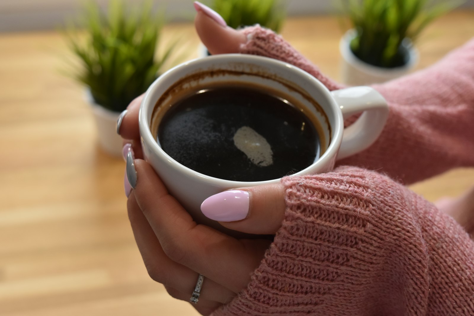 Hands around a warm mug