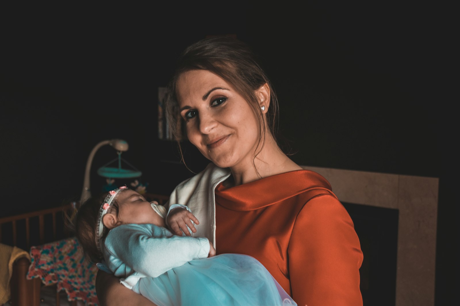 A mother holding her baby